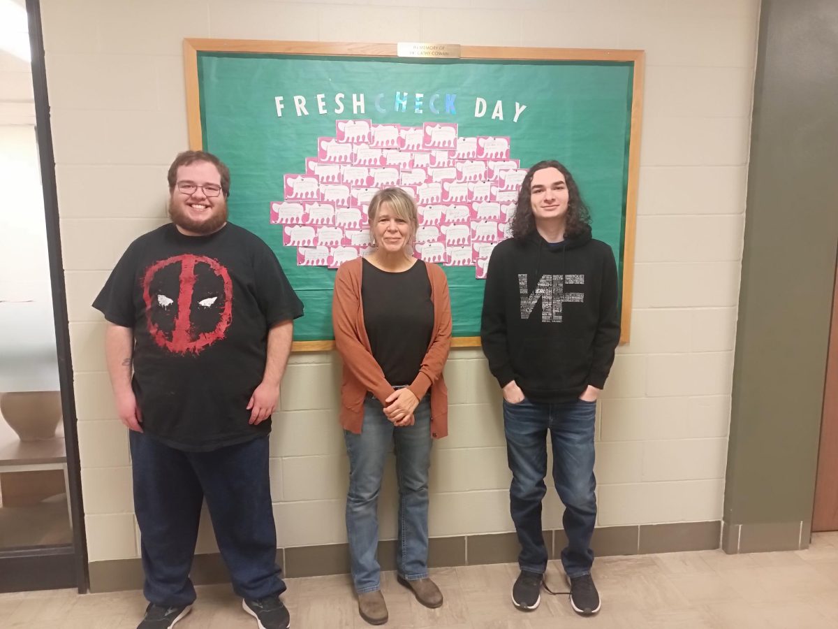 Pictured here is Emmett Fischer, Club Vice President, Christine Olson, Faculty Co-Advisor and Hunter Gruendemann, Club President.