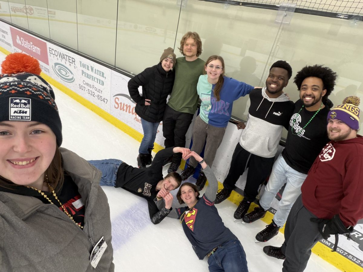 Participants of the ice-skating event posing for a photo